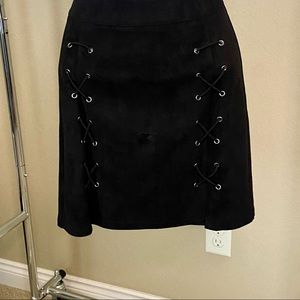 Short black skirt with lacing up the front.